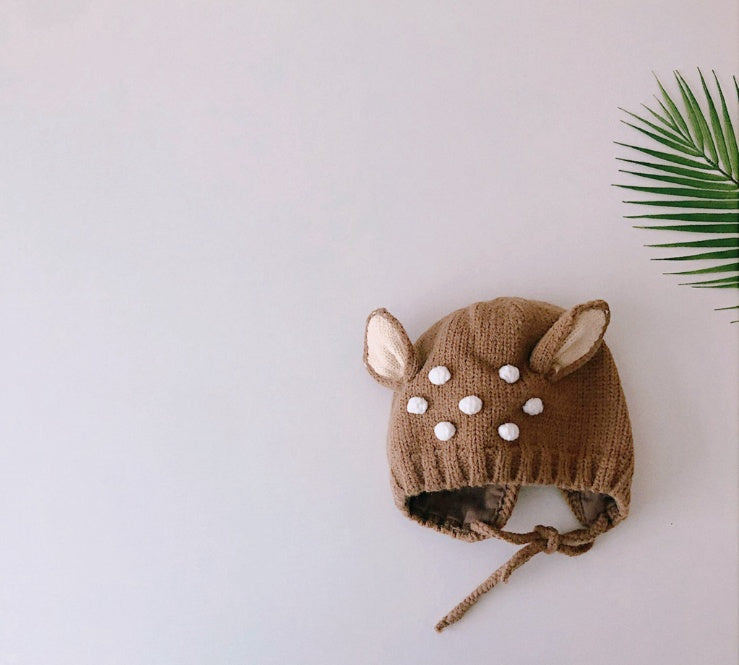 Coffee brown knit baby hat with fawn ears and white pom-pom spots