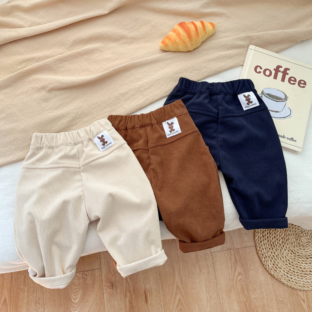 Corduroy baby pants showing label patch