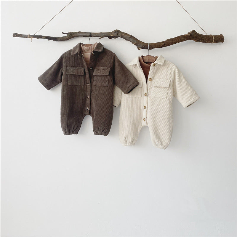 Brown and beige corduroy rompers hanging on a branch