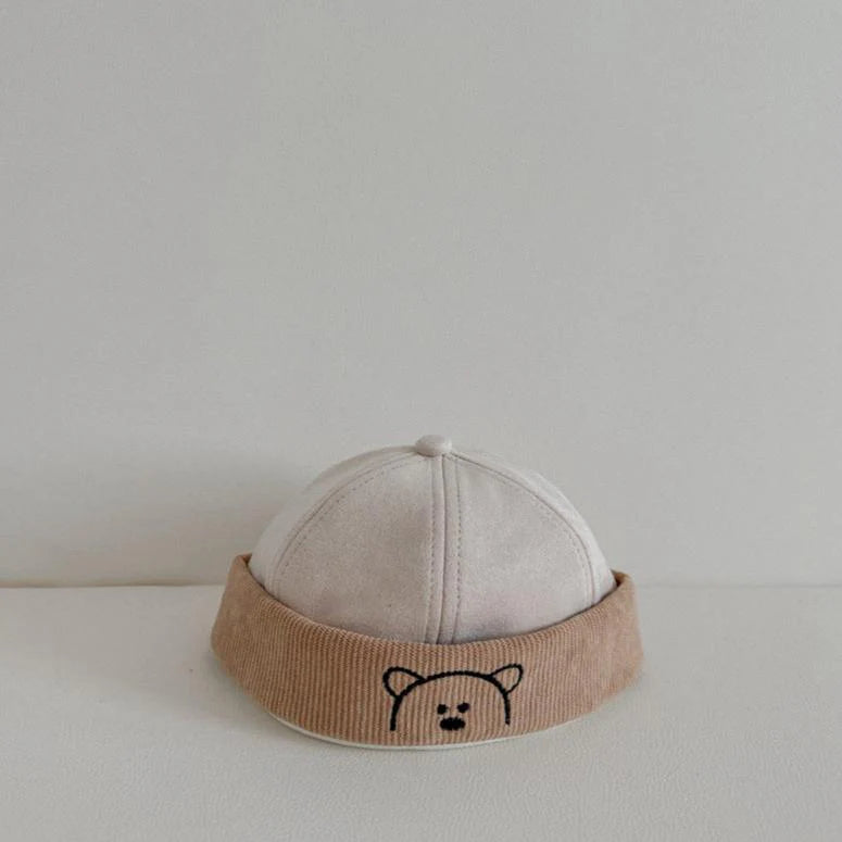 Cream corduroy baby hat with beige bear embroidered band