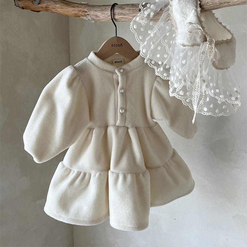 Cream fleece princess dress on a hanger with lace collar