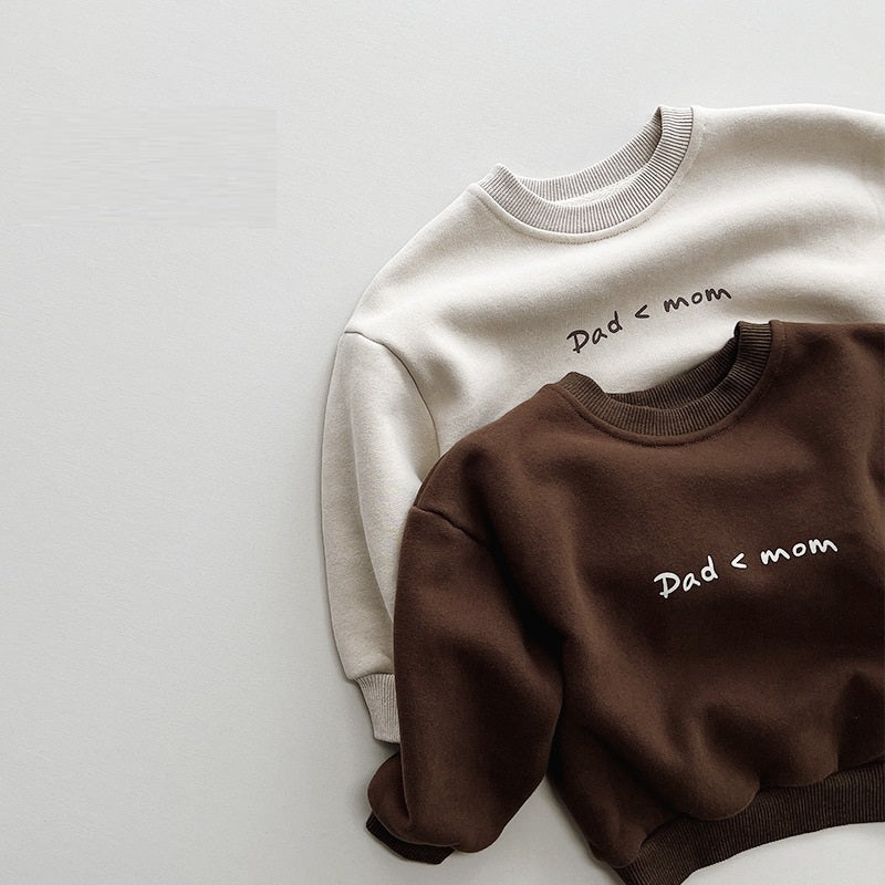 Beige and brown Dad < Mom slogan sweatshirts layered together