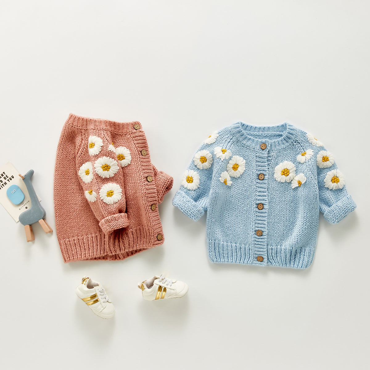 Pink and blue daisy flower knit baby cardigans with toys