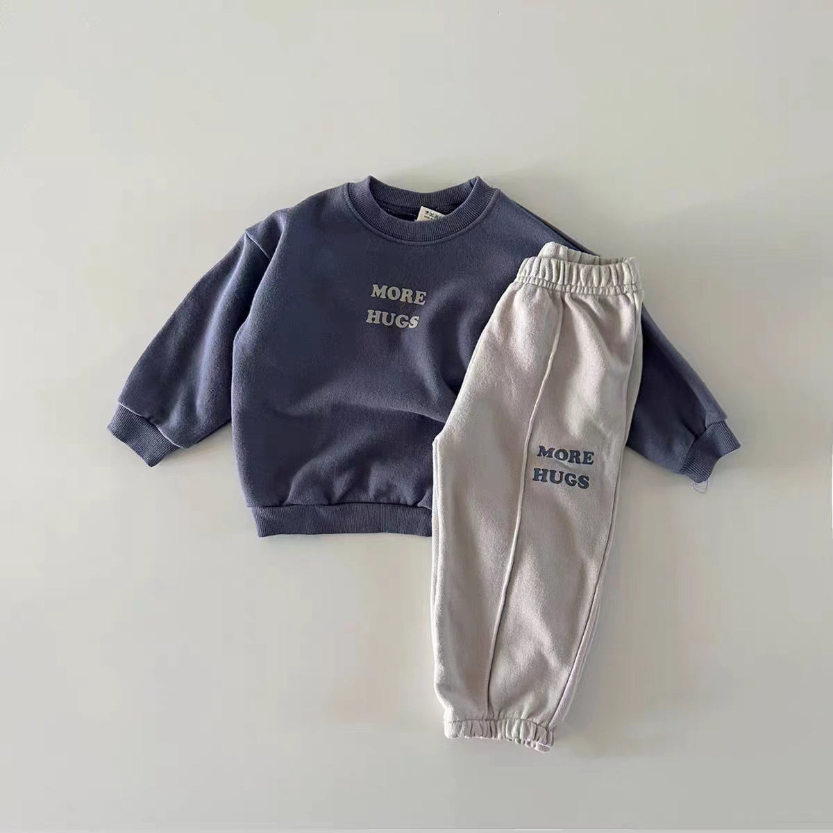 Dark blue More Hugs sweatshirt with gray embroidered joggers