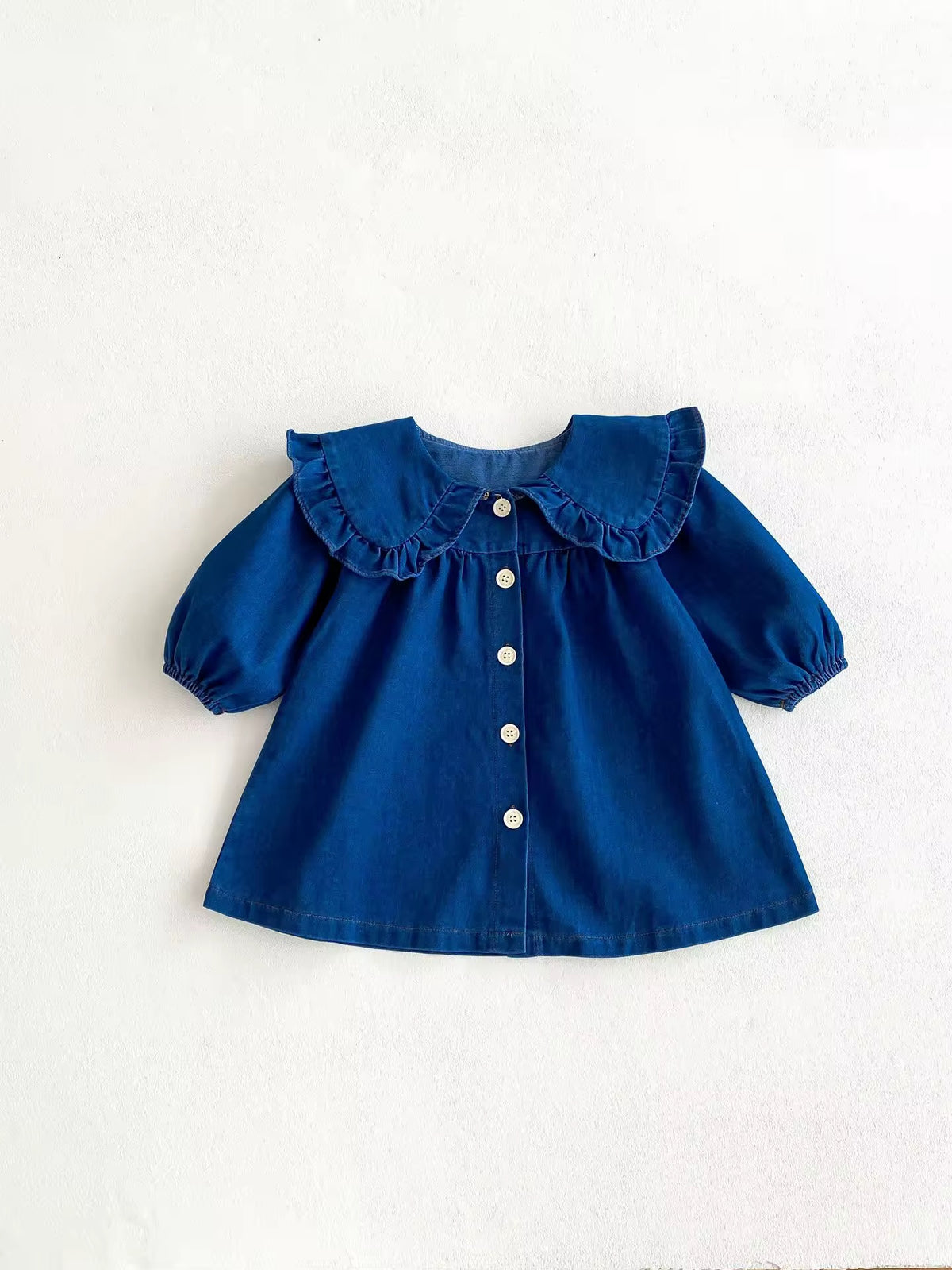 Blue denim button-front baby dress with ruffle collar
