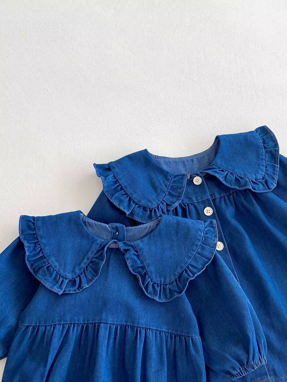 Denim button-front dress layered over the matching romper