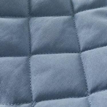 Close-up of diamond quilting on blue jacket