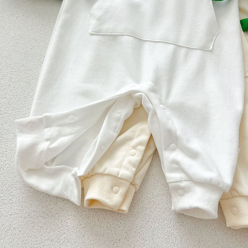 Close-up of leg snaps on dinosaur jumpsuit
