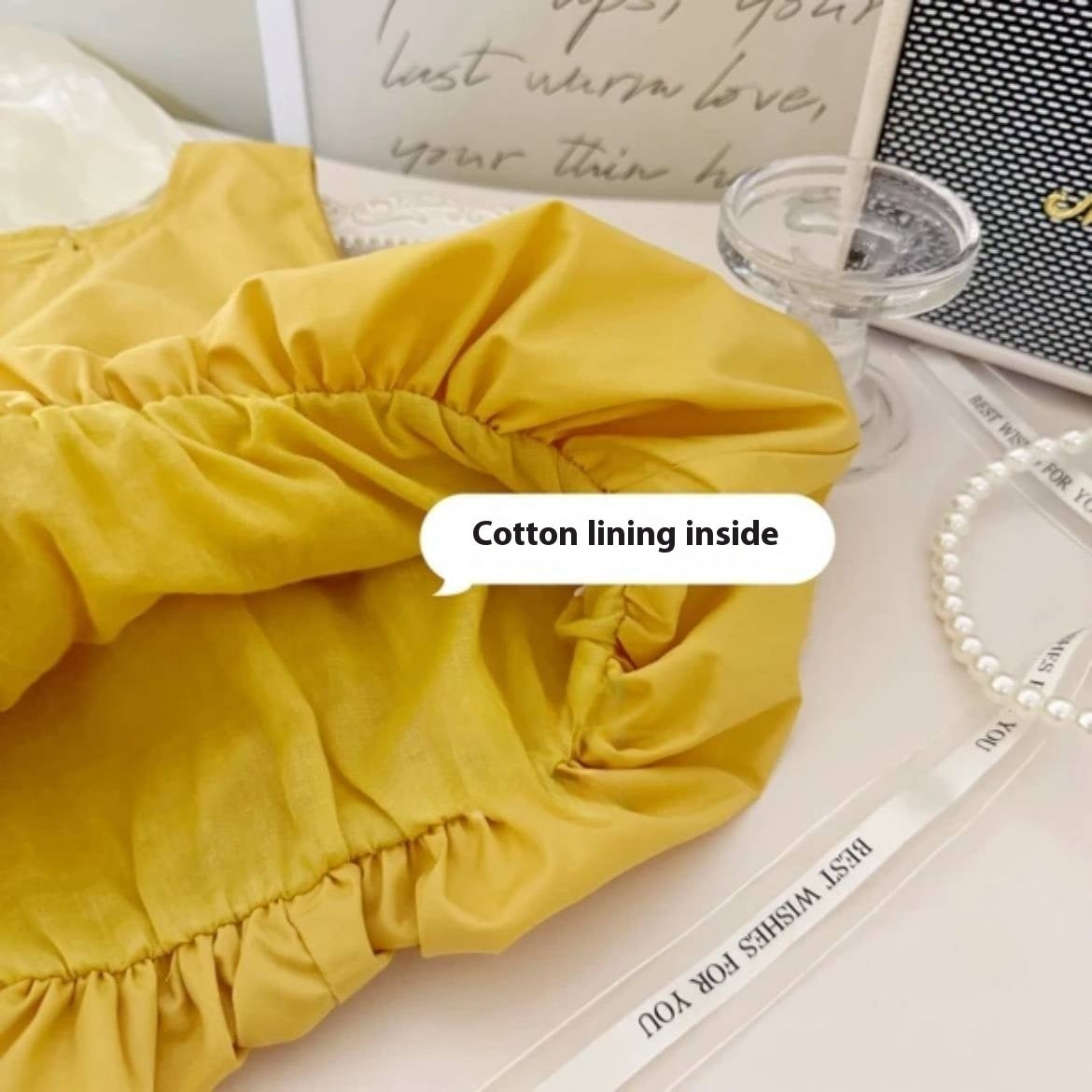 Inside view of yellow duck dress showing cotton lining