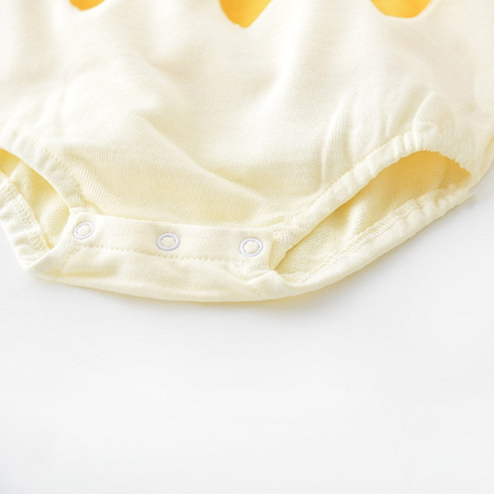 Close-up of snap crotch on cream bottom of egg romper