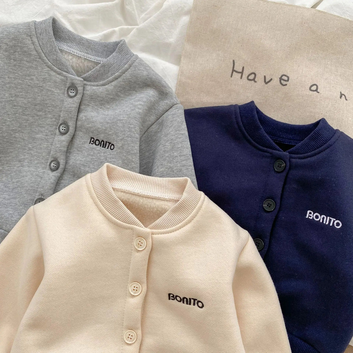 Close-up of embroidered lettering on baby jackets