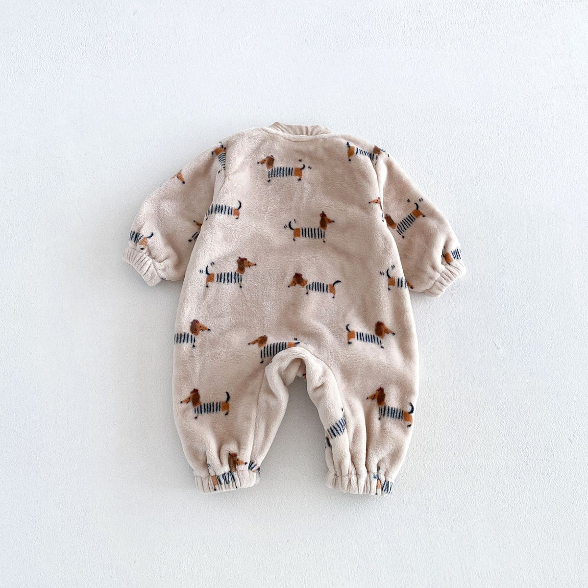 Back view of the oatmeal dachshund print baby romper