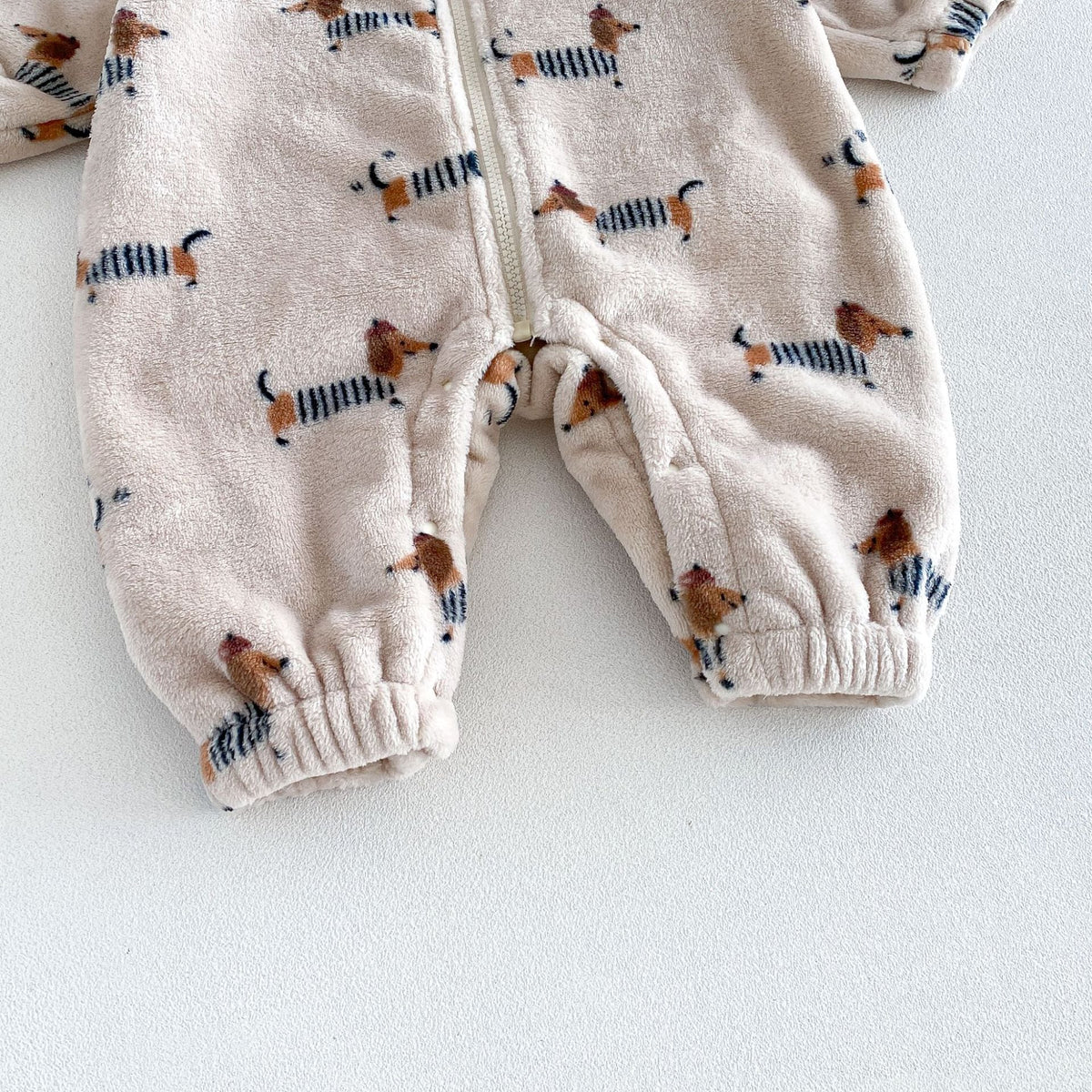 Elastic ankle cuffs on the dachshund print baby romper