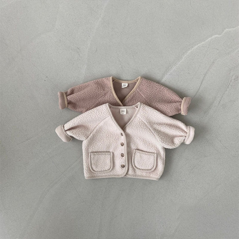 Pink and beige fleece cardigans layered