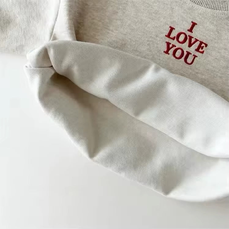 Inside view of warm fleece lining on oatmeal sweatshirt