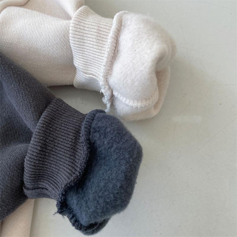 Close-up of soft brushed fleece lining inside romper cuffs