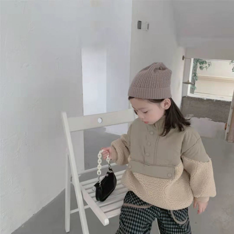 Girl in fleece pullover and check trousers