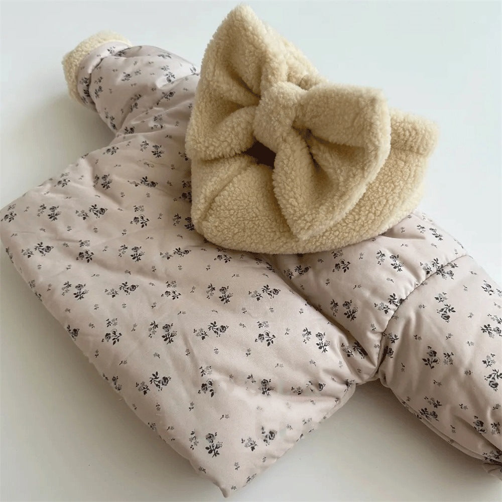 Close-up of plush bow on floral jacket hood