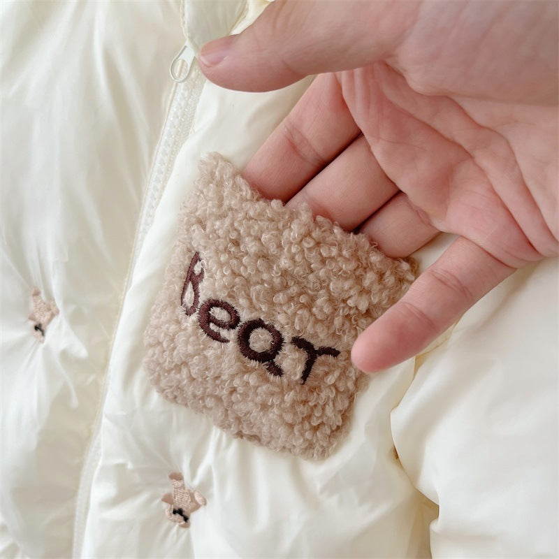 Close-up of fluffy Bear pocket on snowsuit