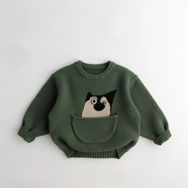 Forest green knit sweater with dog peeking from pocket