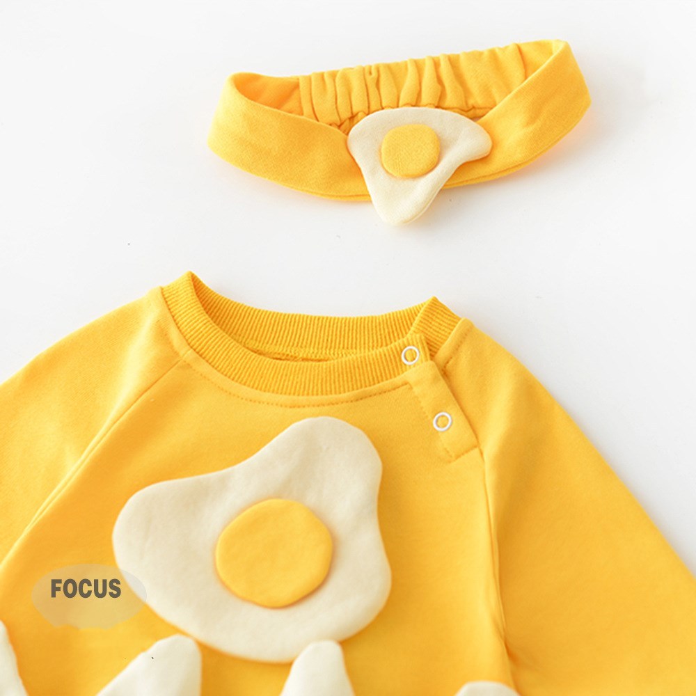 Close-up of fried egg design and headband