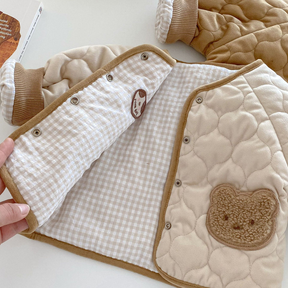 Gingham check lining inside reversible quilted baby coat