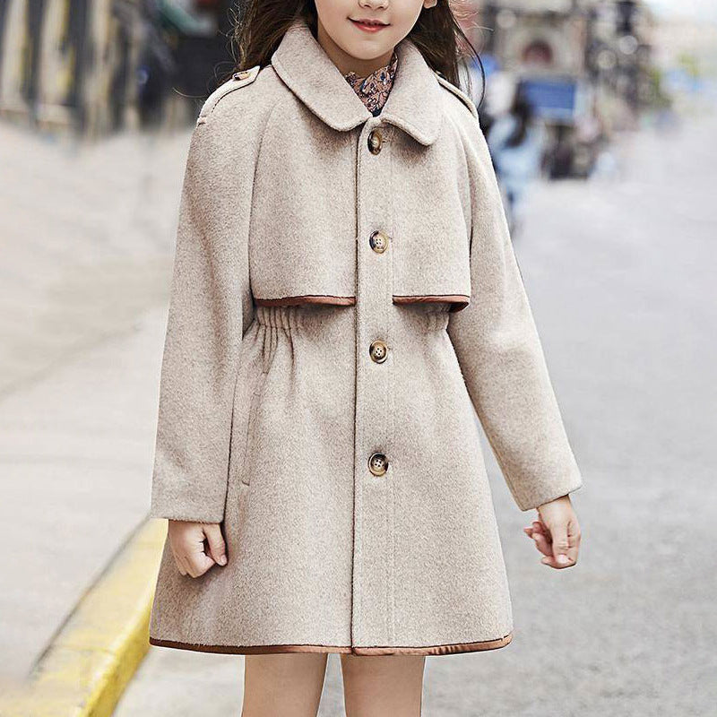 Girl wearing oatmeal mid-length wool coat outdoors