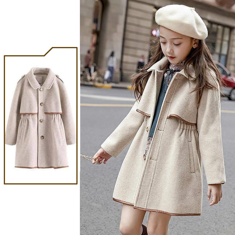 Girl in oatmeal wool coat and beret on the street