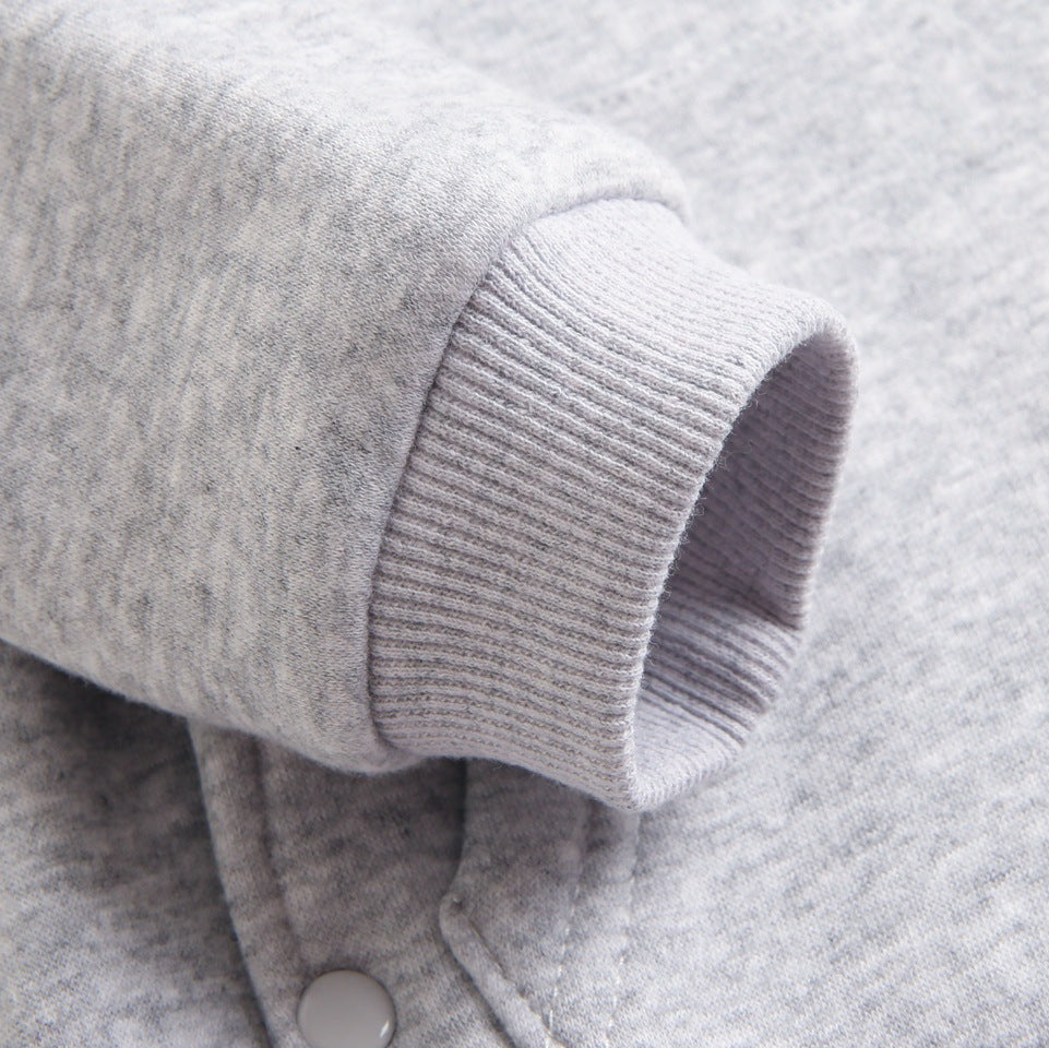 Close-up of ribbed cuff on gray jumpsuit