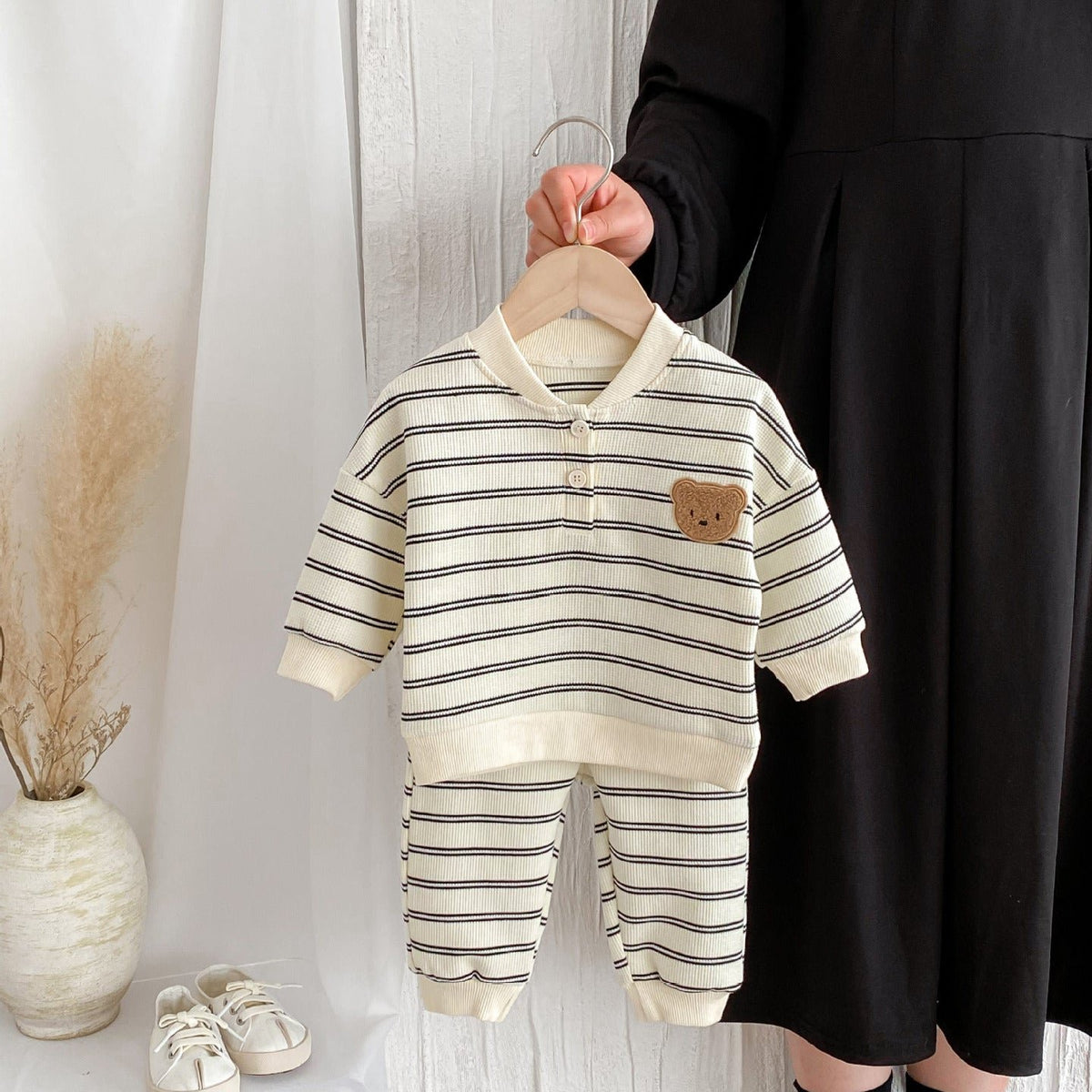 Gray striped bear set held on a hanger