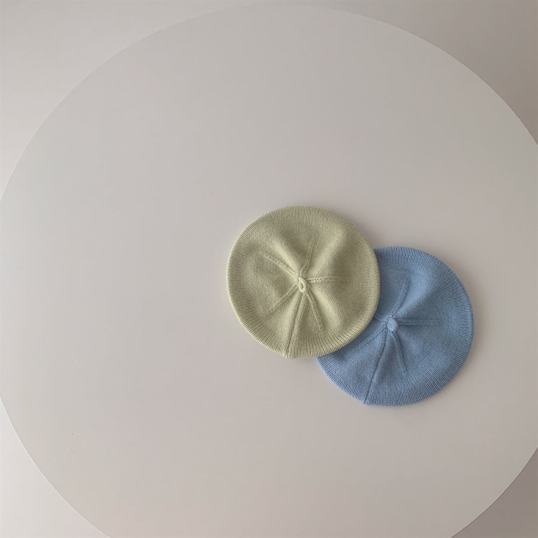 Green and blue knitted baby berets