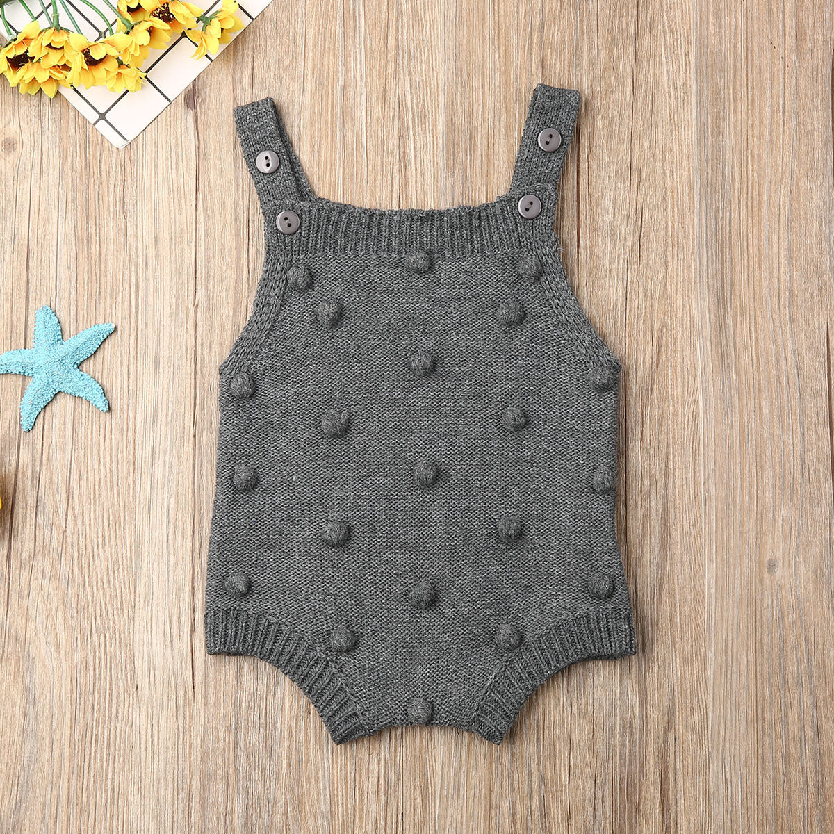 Grey sleeveless pom-pom knit baby romper