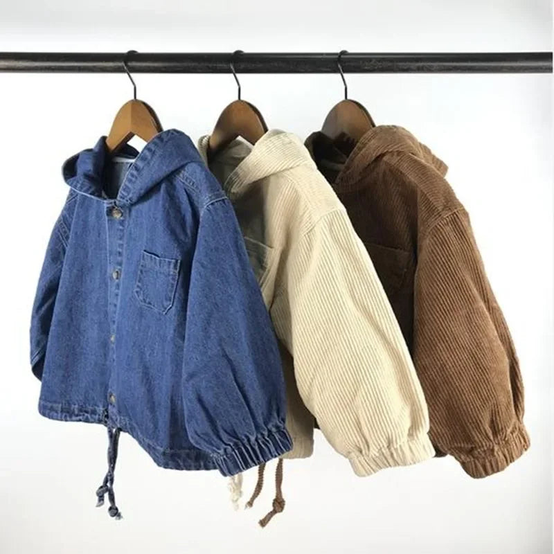 Blue, apricot and coffee hooded jackets on a rail