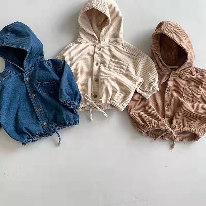 Blue denim, apricot and coffee hooded jackets laid flat