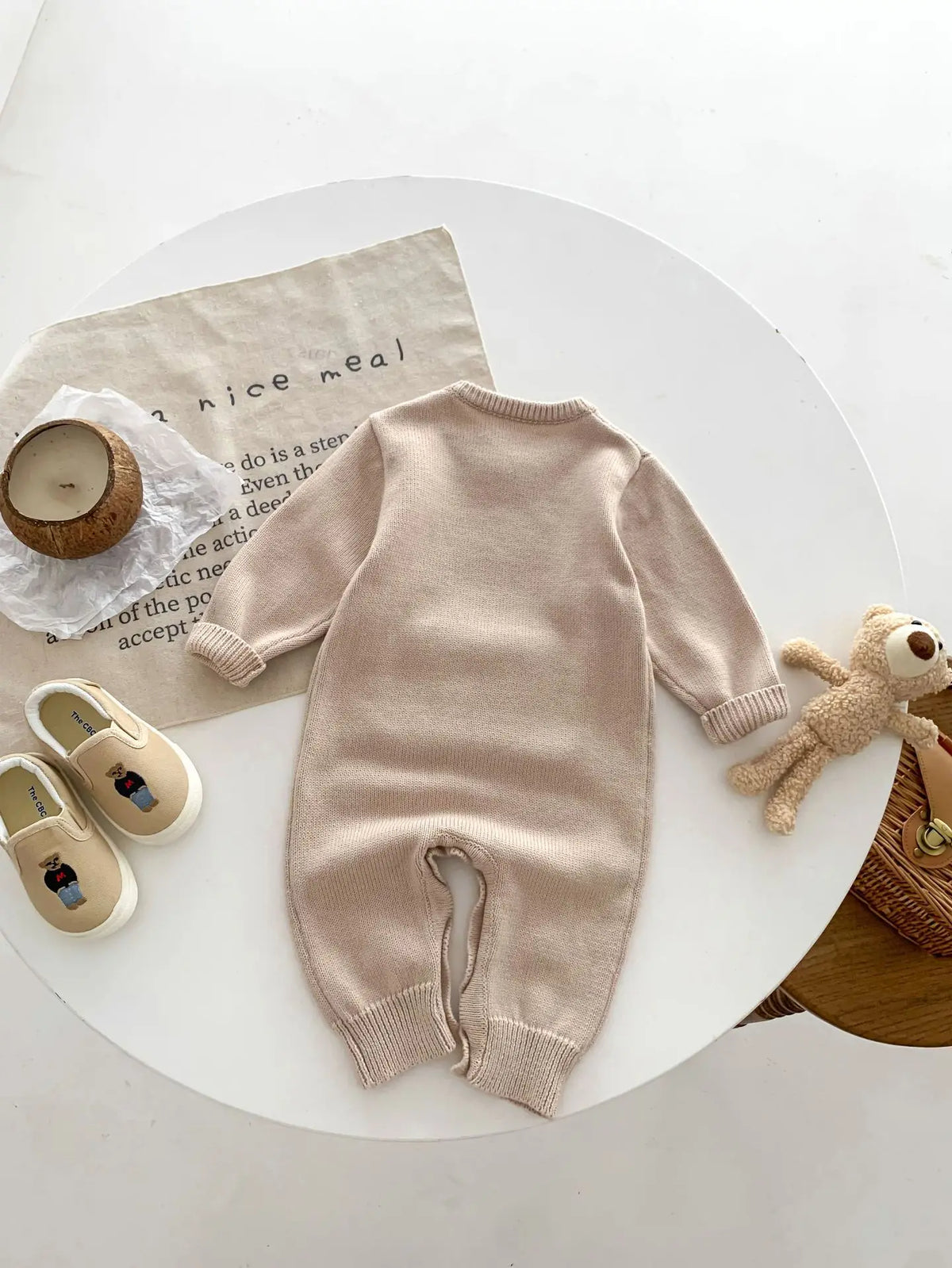 Back view of oatmeal knit baby romper
