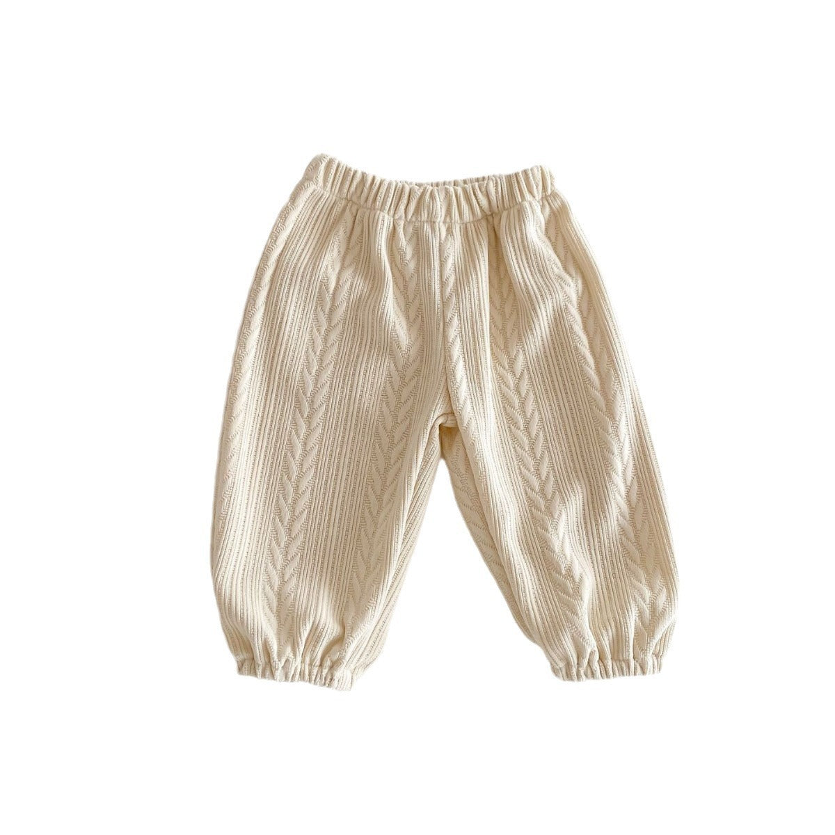 Light beige baby trousers on white background