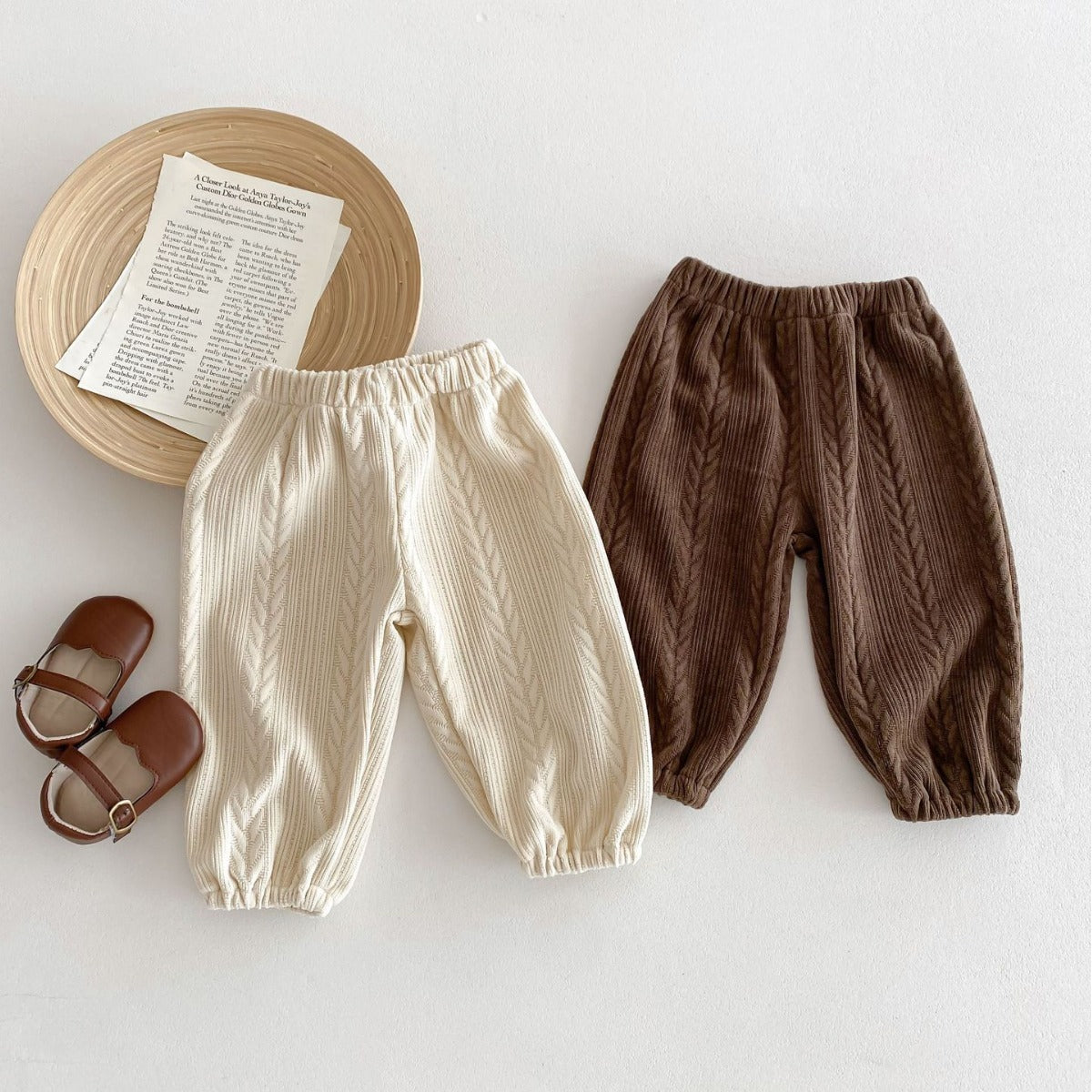 Light beige and brown lightweight baby trousers