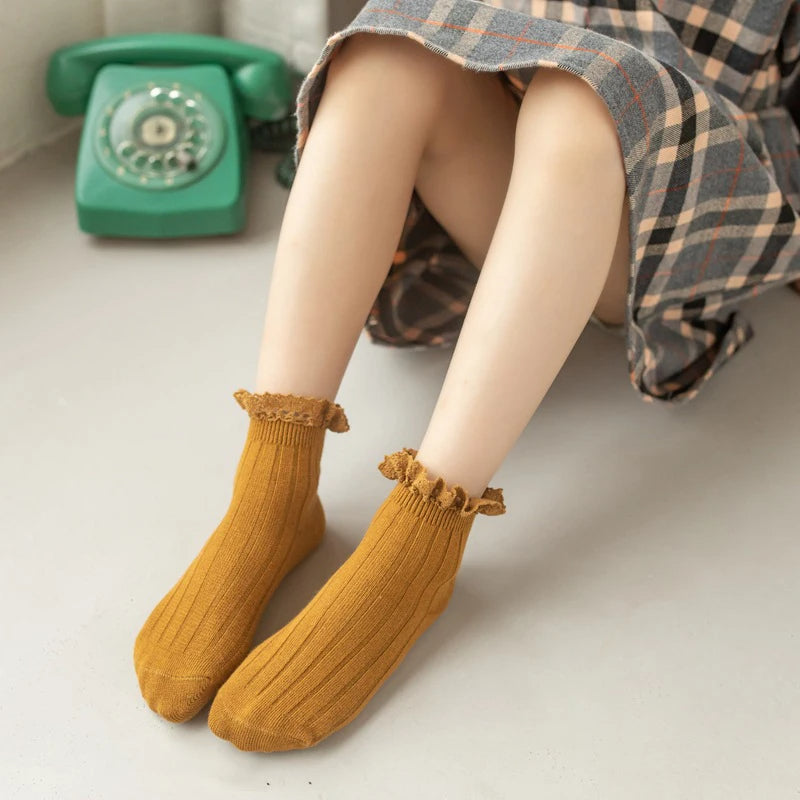 Child wearing mustard ribbed frill socks