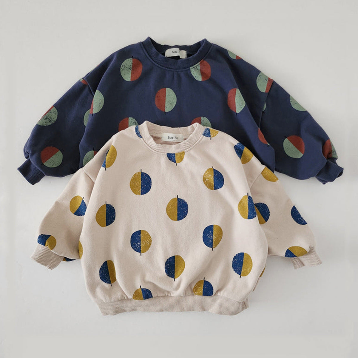 Navy and beige dot print pajama tops stacked