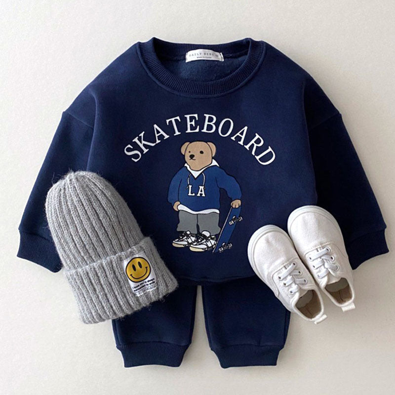 Dark blue skateboard bear sweatshirt and joggers with beanie and sneakers