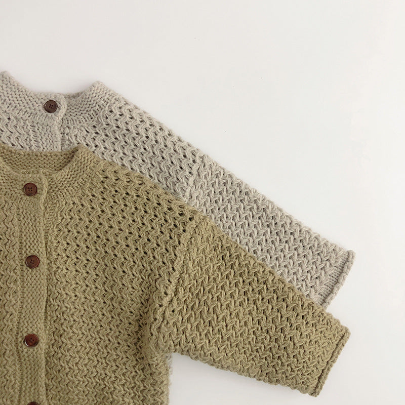 Gray and green open knit cardigans layered together