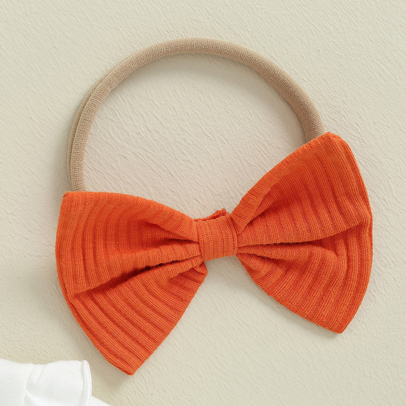 Orange ribbed bow headband