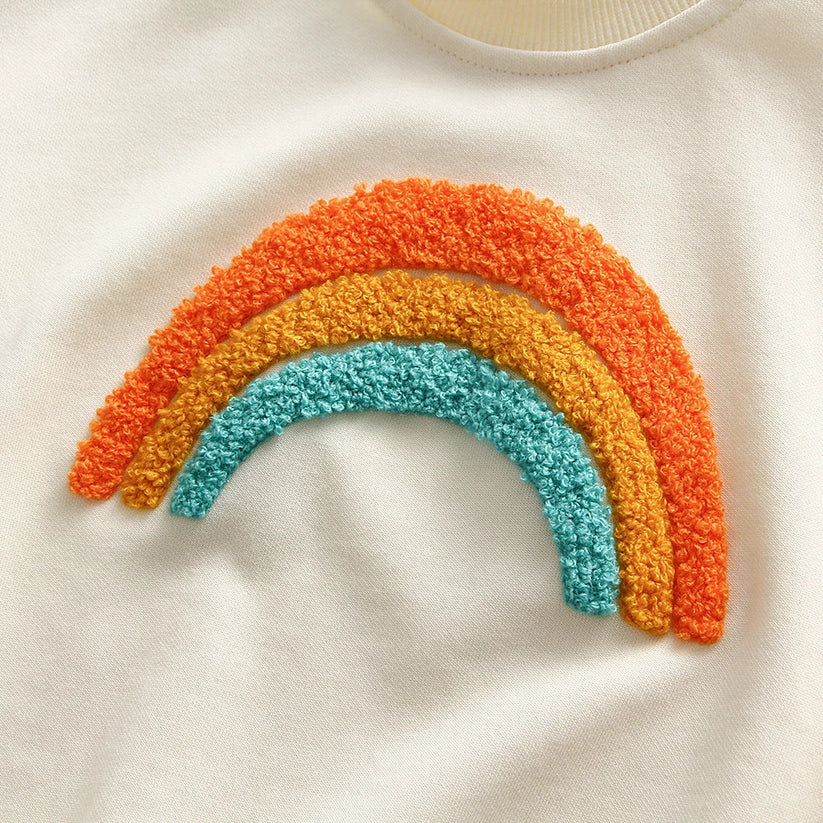 Close-up of orange and teal chenille rainbow