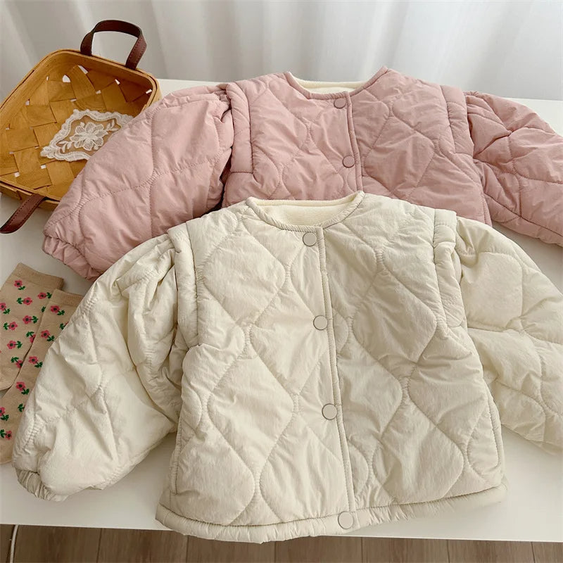 Pink and beige quilted jackets layered