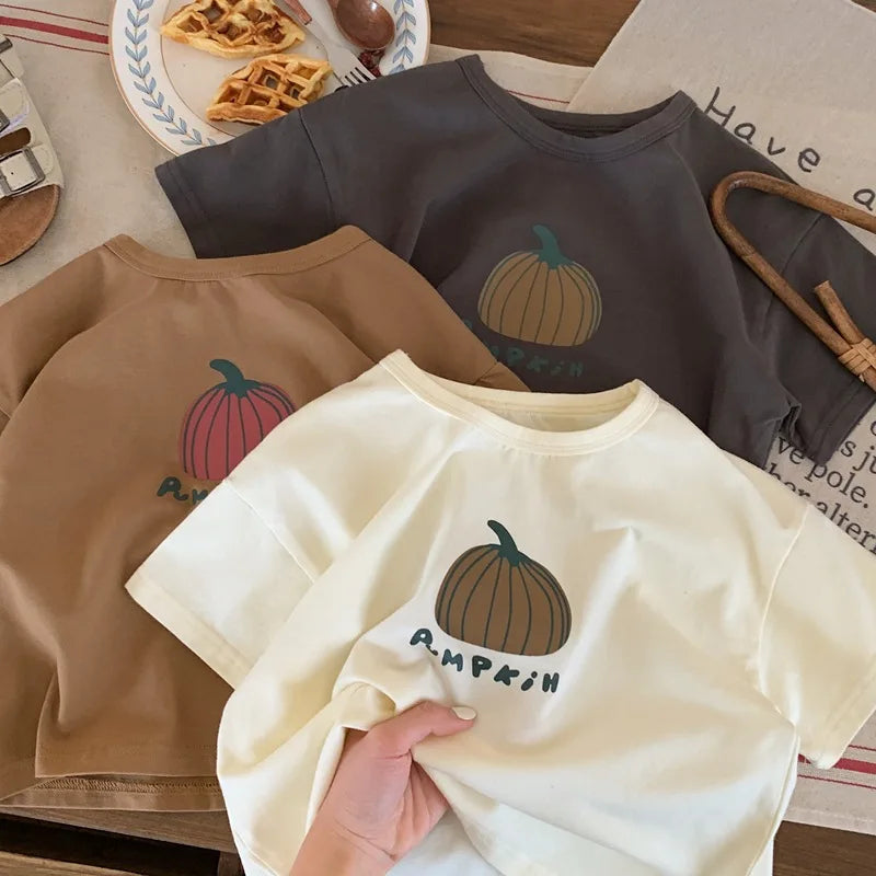 Pumpkin print tees laid flat