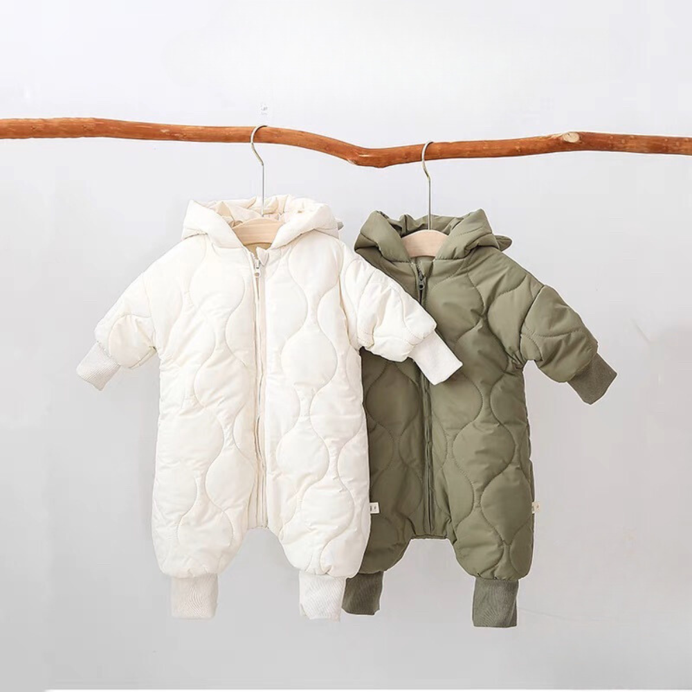 White and green quilted bear ear snowsuits on hangers