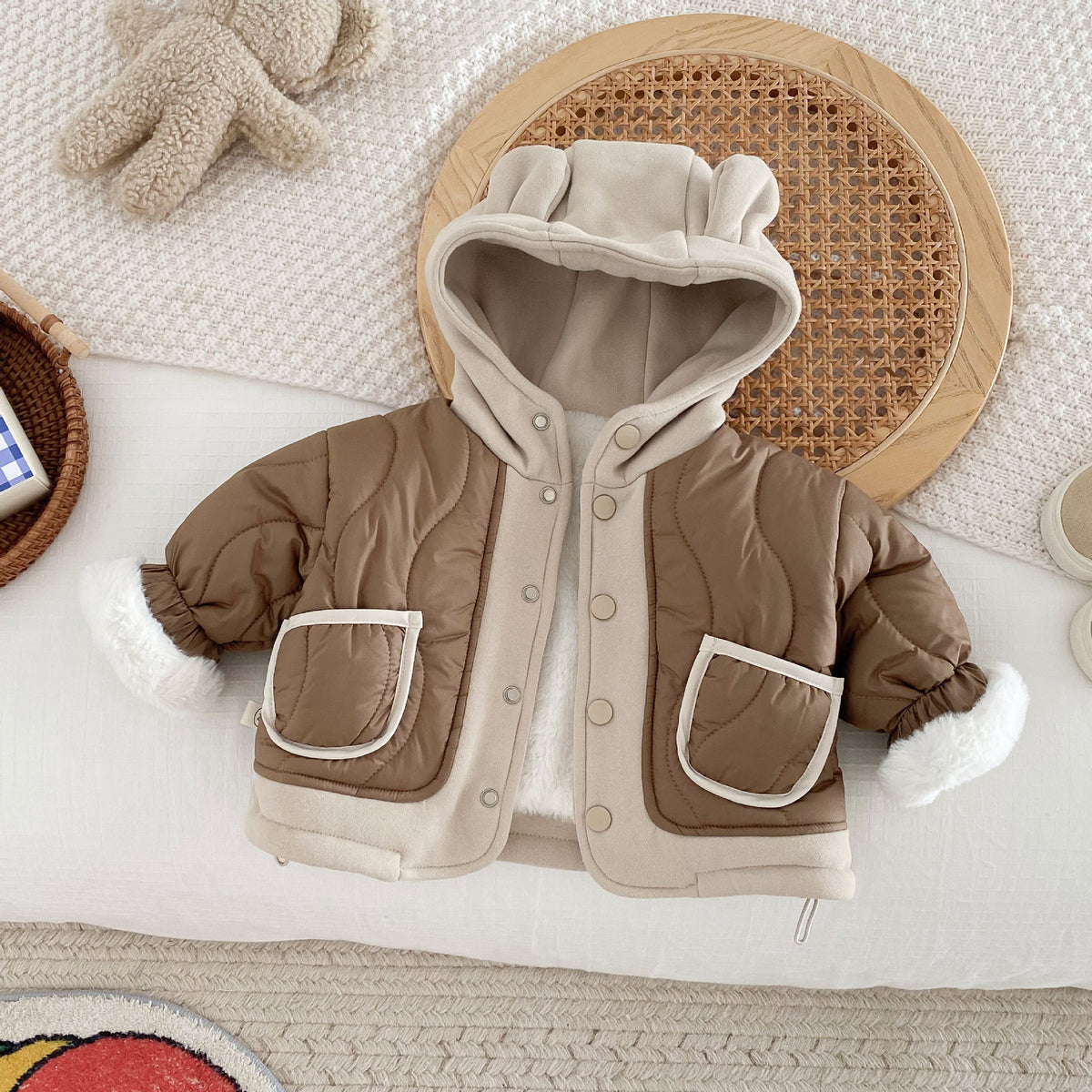 Brown quilted hooded baby jacket with bear ears and cream trim