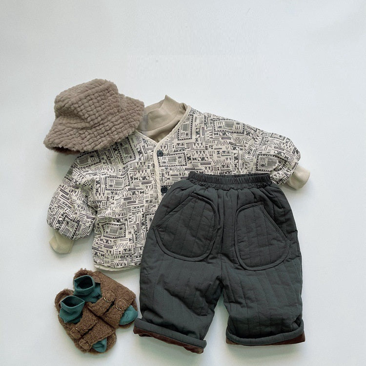 Dark green quilted pants styled with knit jacket and hat