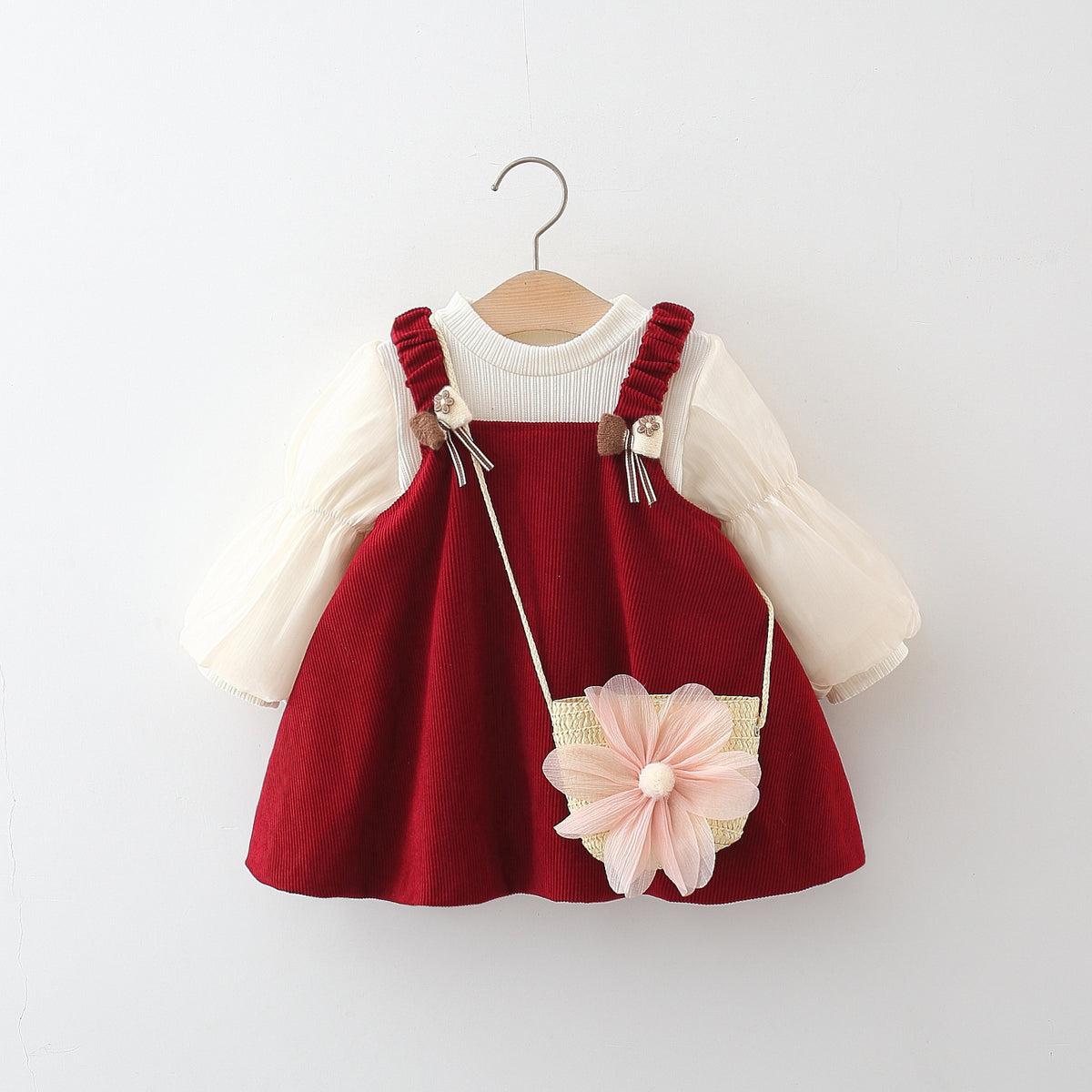 Red corduroy pinafore dress set with cream puff sleeve top and pink flower bag