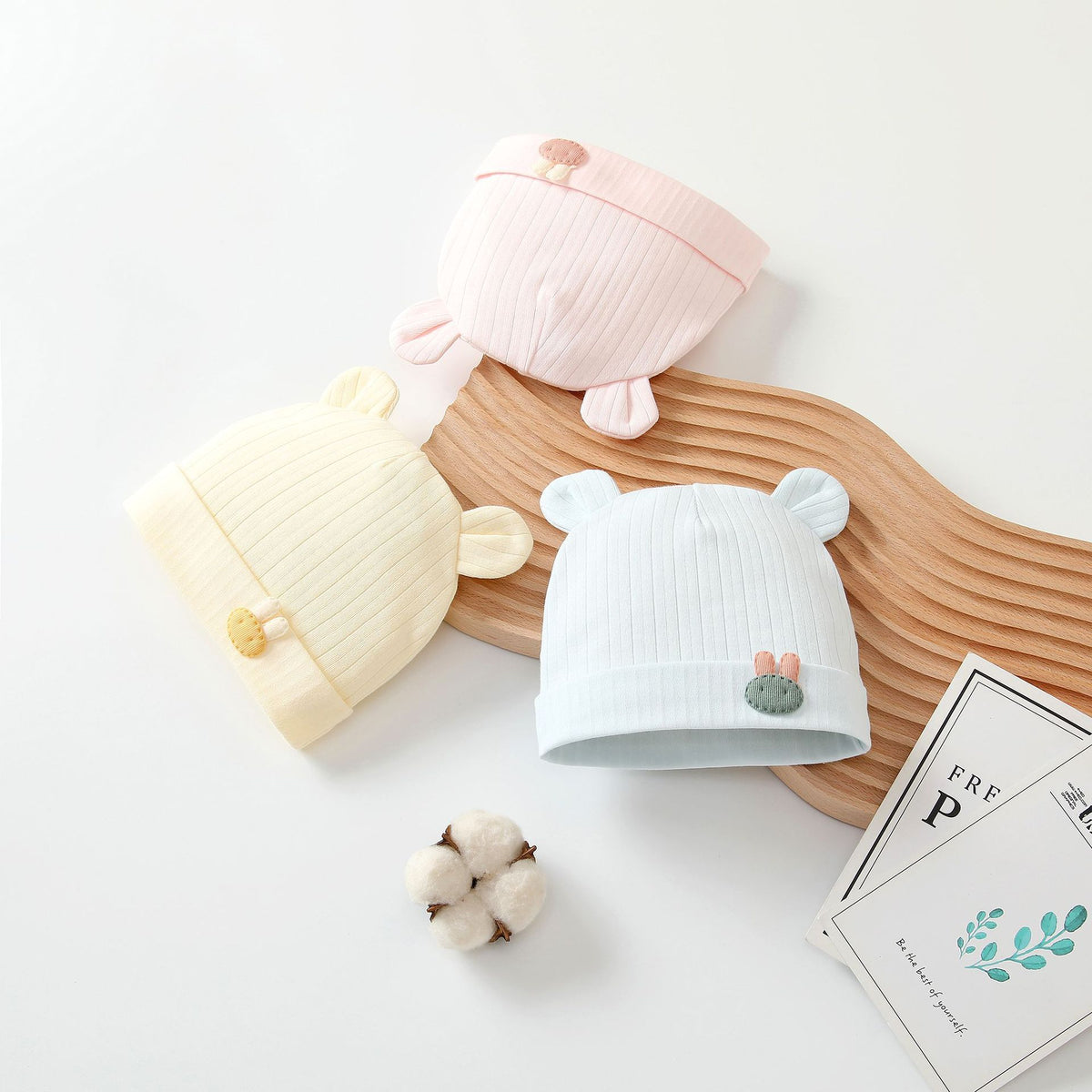Yellow, pink and blue ribbed baby beanies with ears